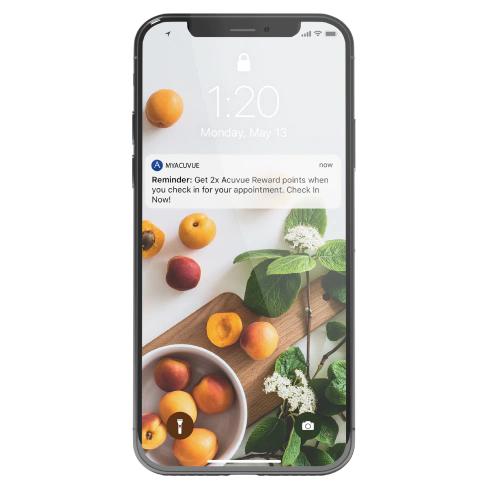 MYACUVUE notification on a iPhone with fruit background.
