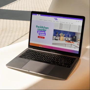 magicbullet website on a grey laptop outside.