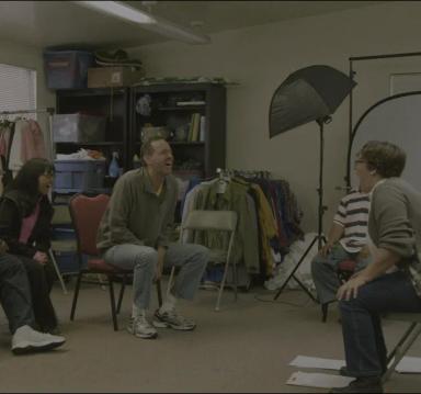 Image of people sitting at a meeting.