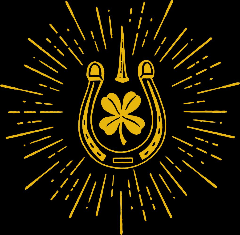 Yellow Horseshoe with a clover surrounded by sun rays.