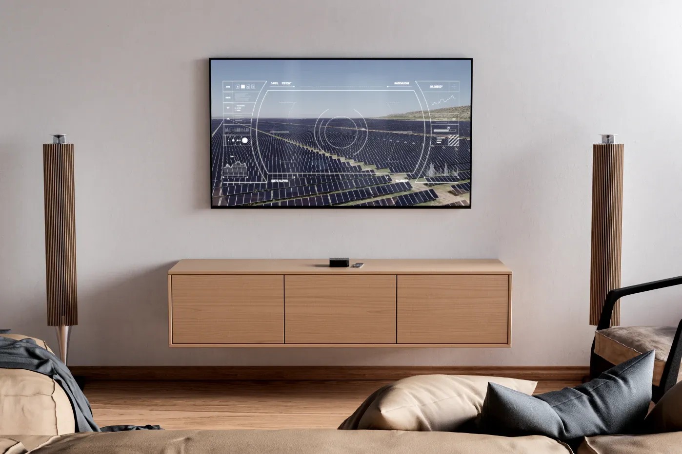Image of a solar panel field projected on a TV in a livingroom.